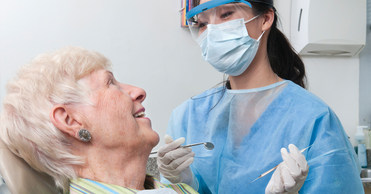 Dental professional with patient